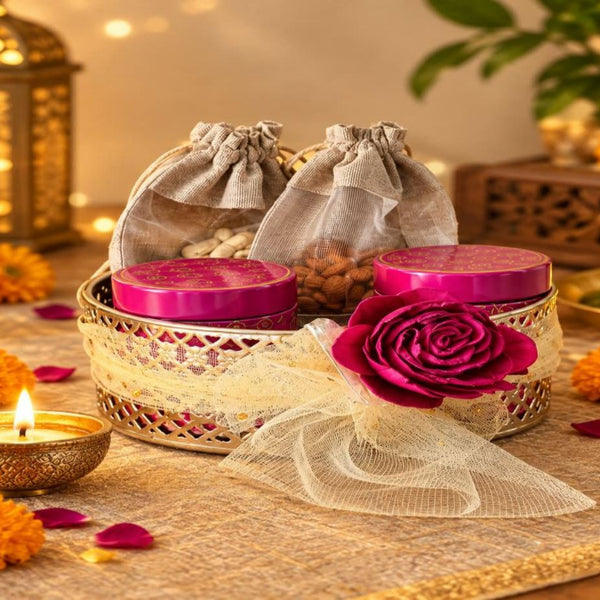 Festive Radiance hamper in a woven tray with tins and diya